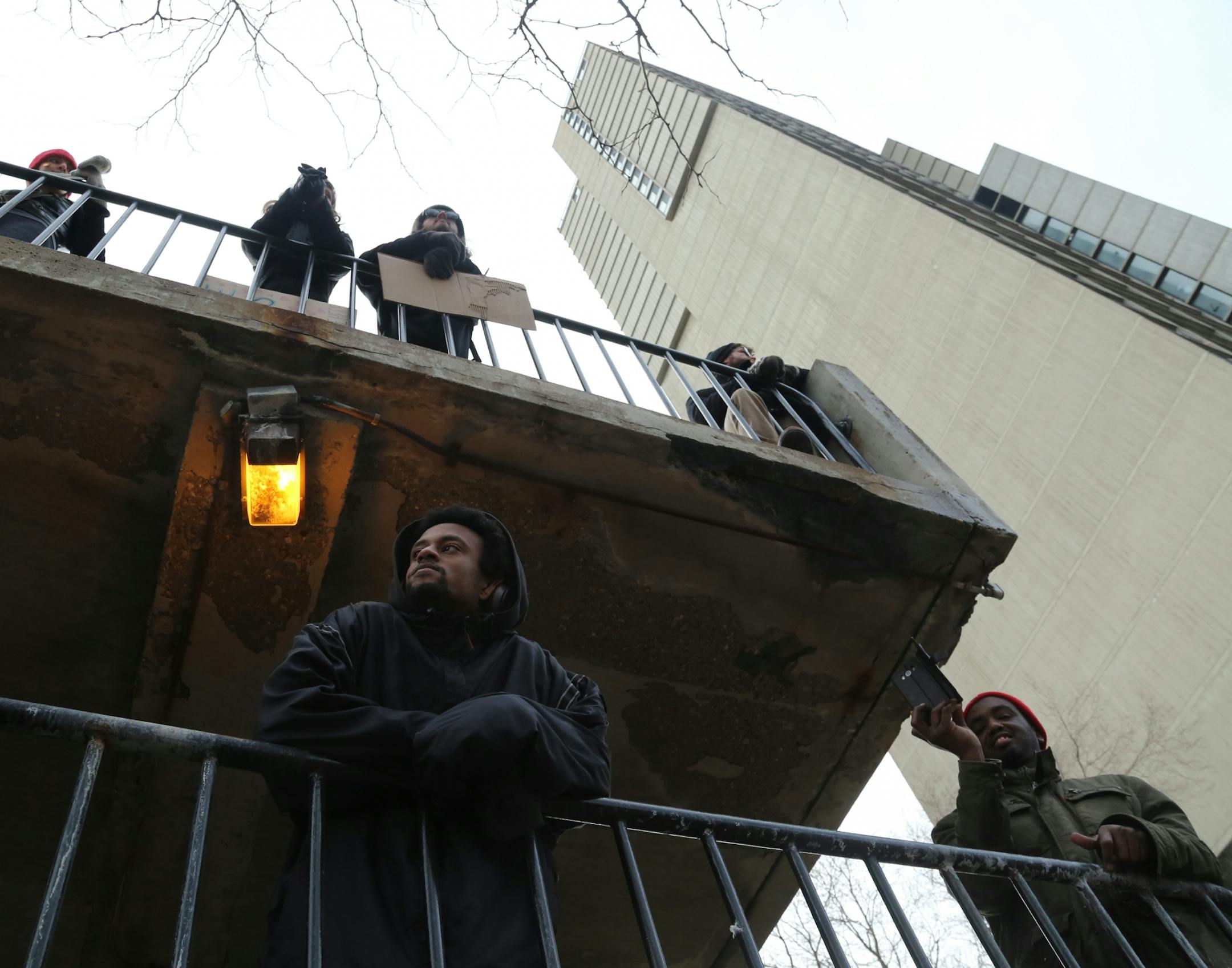 Onlookers take in the portion of The Caravan of Love: A Walk of Love for Immigrants and Refugees at its final destination in the Cedar-Riverside neighborhood.