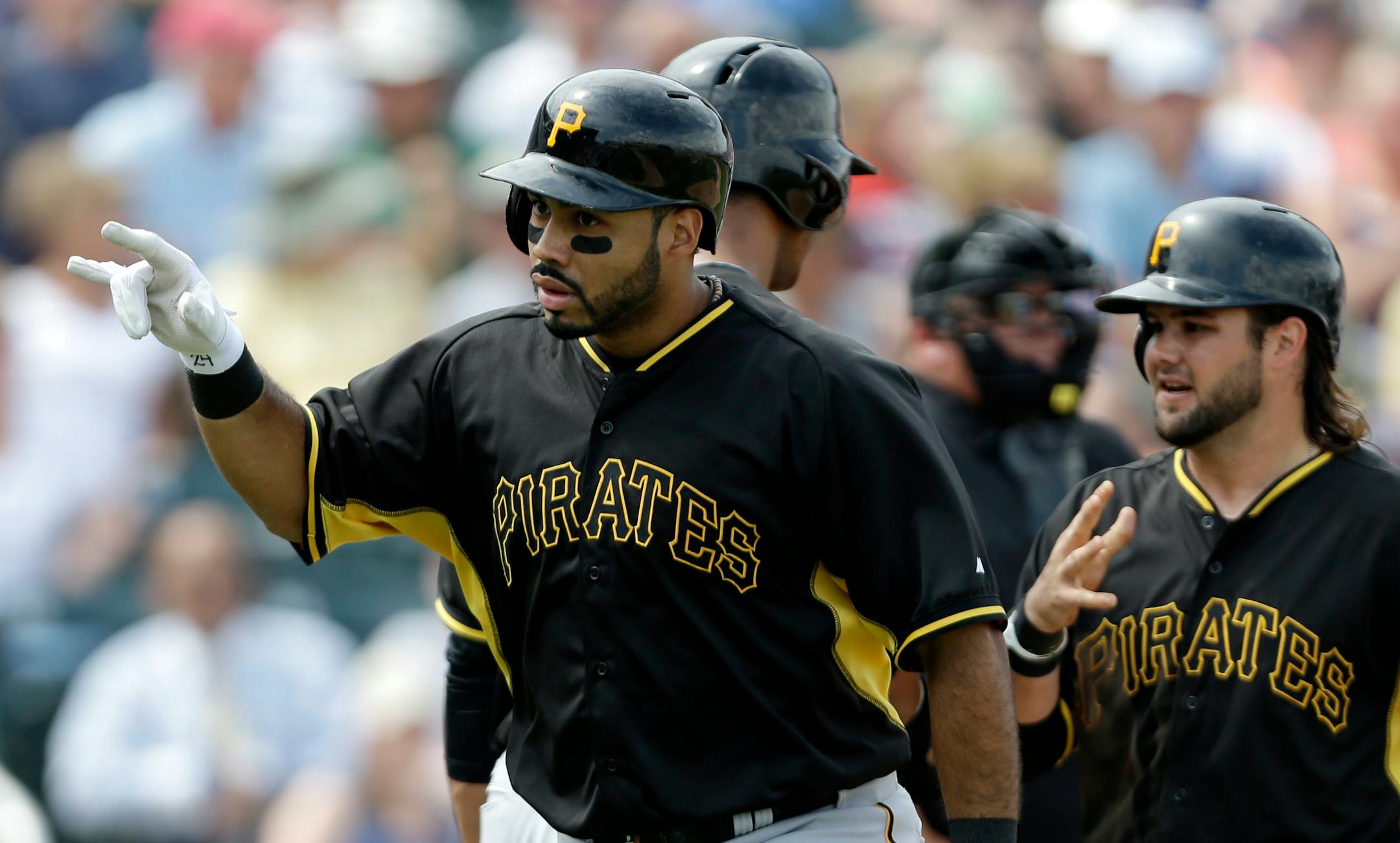 Pittsburgh Pirates third baseman Pedro Alvarez reacts after bringing home Jaff Decker, right, on a two-run homer in the third inning of an exhibition baseball game in Fort Myers, Fla., Wednesday, March 12, 2014. (AP Photo/Gerald Herbert)