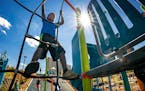 Boah McCulloch, 6, climbed on the new playground. Skyline Tower is in the background.