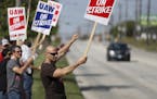 Carl Cvetkovich, front, joins dozens of fellow striking UAW workers outside the GM Parma facility in Parma, Ohio, Monday, Sept. 16, 2019. (Marvin Fong