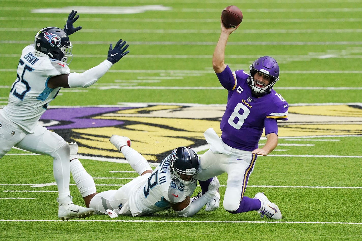 Minnesota Vikings quarterback Kirk Cousins (8) was sacked by Tennessee Titans outside linebacker Harold Landry (58) in the third quarter. ] ANTHONY SOUFFLE • anthony.souffle@startribune.com The Minnesota Vikings played the Tennessee Titans in an NFL game, sans fans to comply with legislation meant to slow the spread of COVID-19, Sunday, Sept. 27, 2020 at U.S. Bank Stadium in Minneapolis.