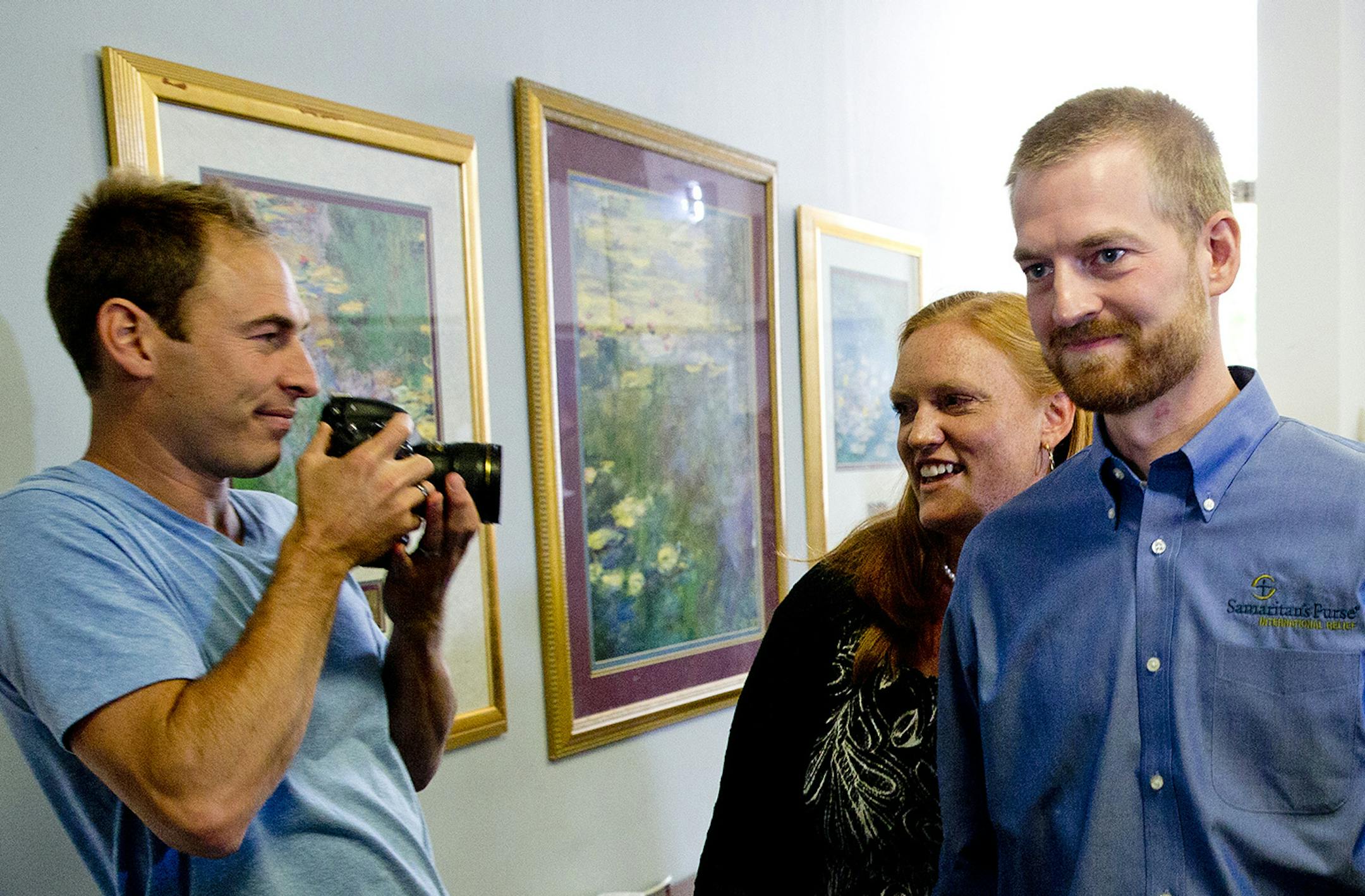 Ebola victim Dr. Kent Brantly and his wife Amber leave a news conference after being released from Emory University Hospital., Thursday, Aug. 21, 2014, in Atlanta. (AP Photo/John Bazemore) ORG XMIT: MIN2014082214240030
