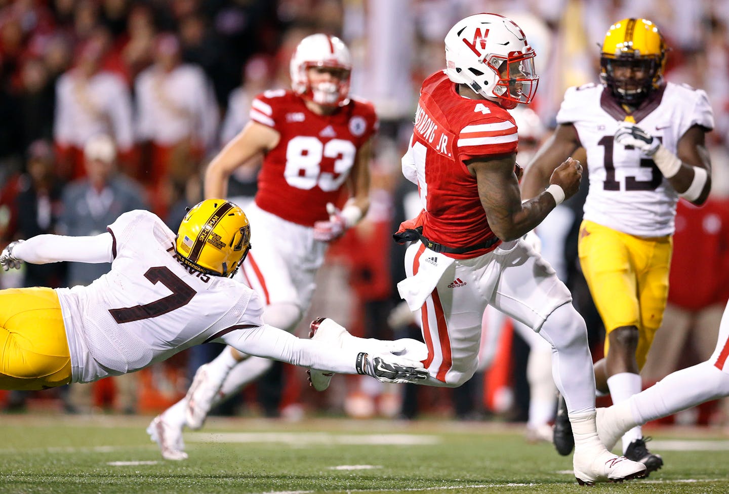 Minnesota defensive back Damarius Travis couldn't hold onto Nebraska's quarterback Tommy Armstrong Jr. as he ran into the end zone for a touchdown during the fourth quarter