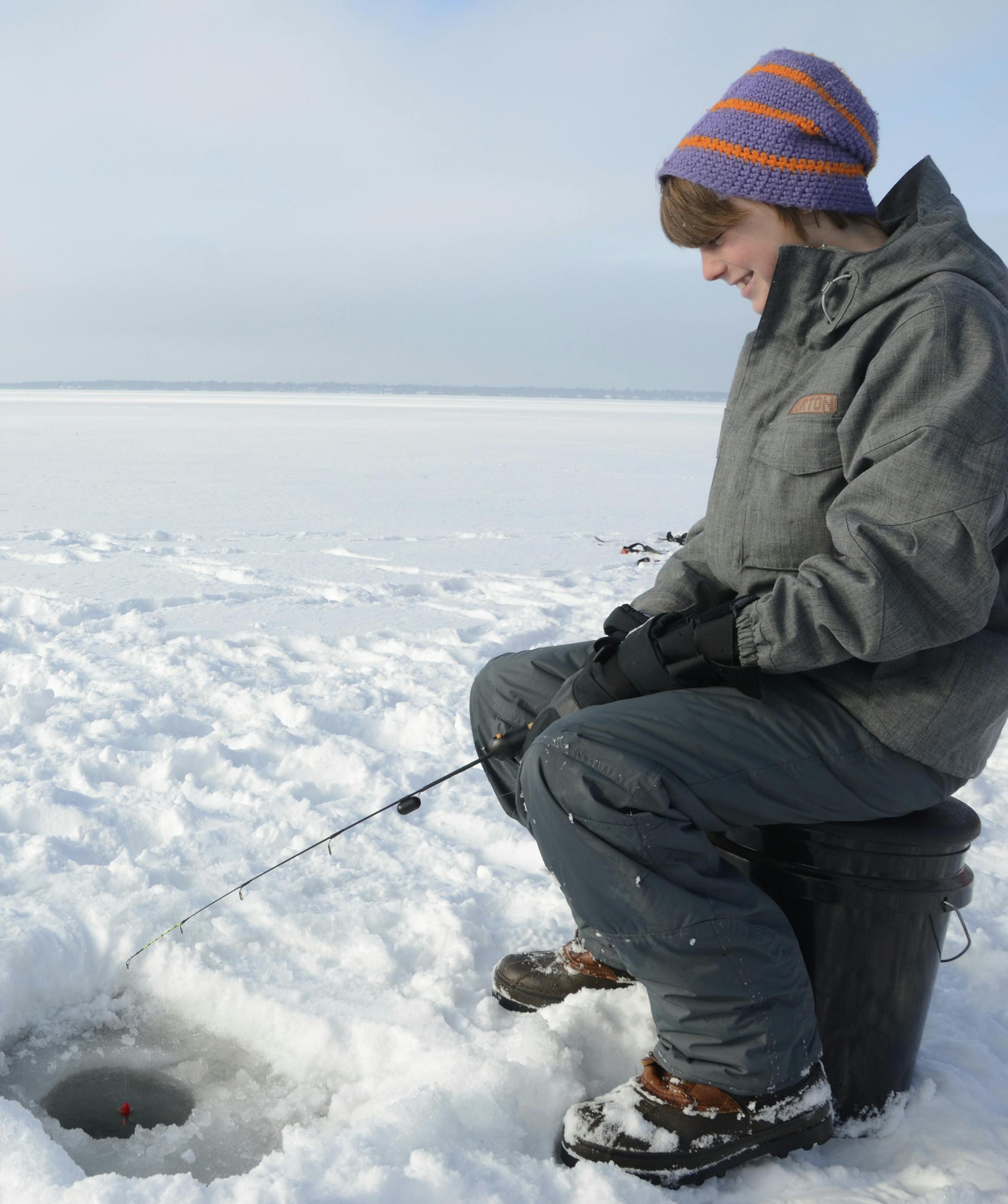 young boy ice fishing