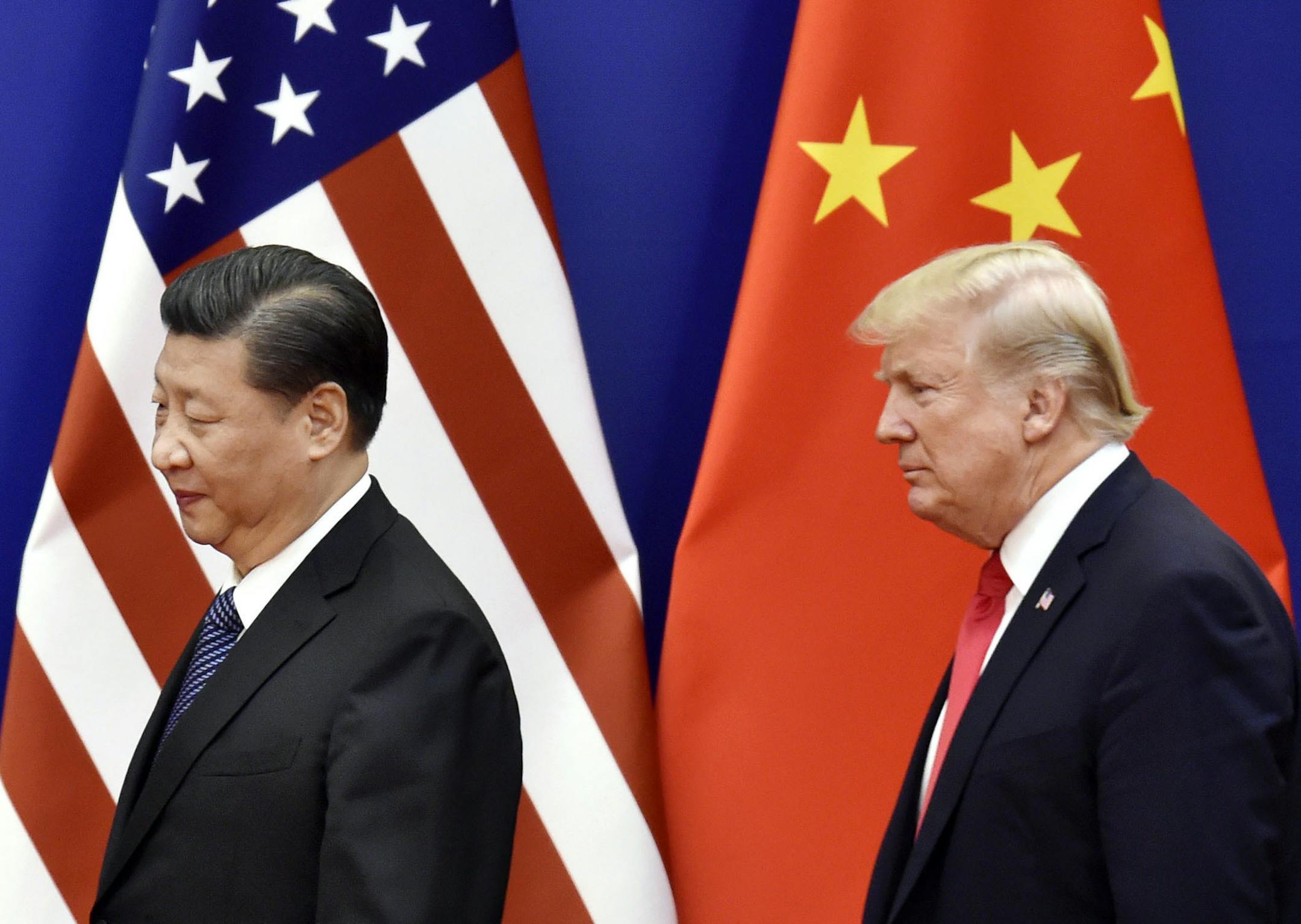File photo taken in November 2017 shows U.S. President Donald Trump (R) and Chinese President Xi Jinping at the Great Hall of the People in Beijing. (Kyodo via AP Images) ==Kyodo ORG XMIT: KYDPL