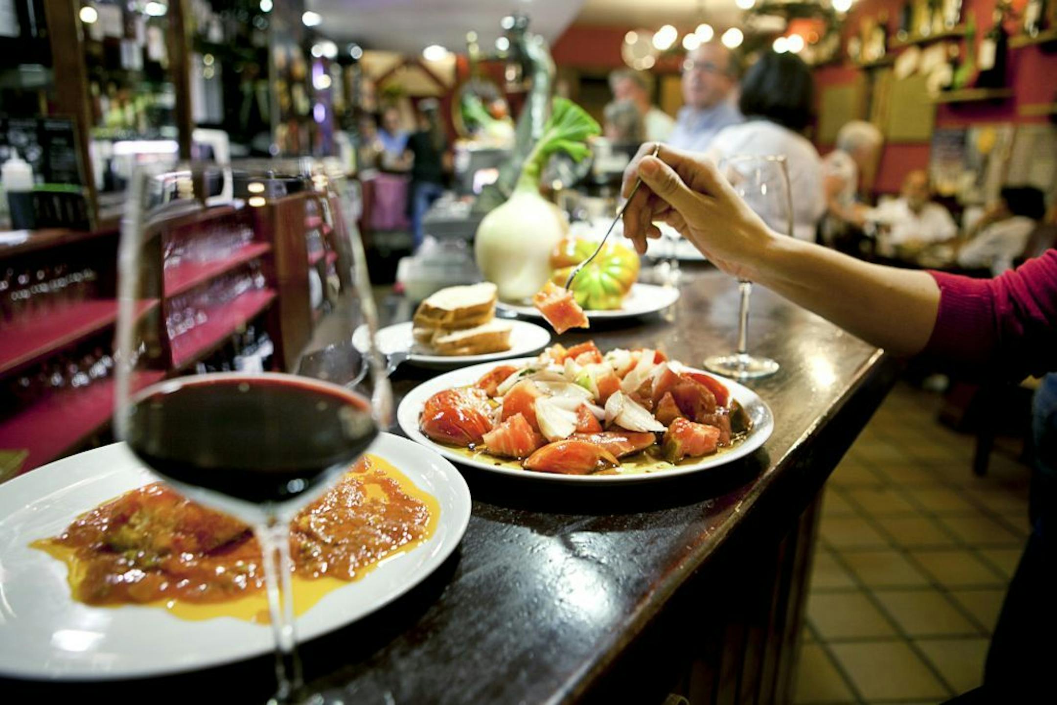 FILE -- Dishes at a restaurant in Logrono, Spain, Sept. 9, 2012. According to new research findings in 2013 about 30 percent of heart attacks, strokes and deaths from heart disease can be prevented in people at high risk if they switch to a Mediterranean diet, of which olive oil, wine and nuts are part of.