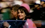 This image made from a home movie released Monday, Feb. 19, 2007 by the Sixth Floor Museum at Dealey Plaza shows former President John F. Kennedy, lef