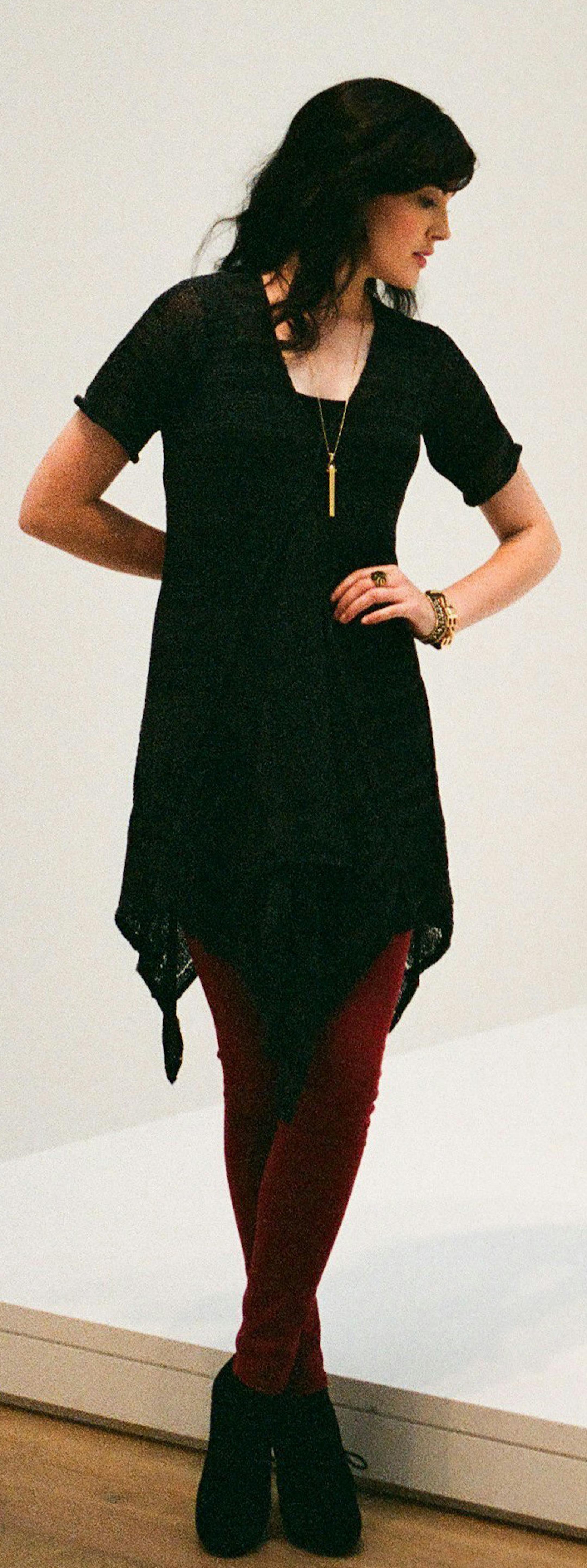 Molly stands next to 'Richard Bellamy Seated,' 1964, by George Segal. She wears a pullover sweater dress with V-neck, raised seams and a keyhole back ($280) at Skif International, 314-773-4401; red Flying Monkey pants ($29.99) at Glik's, www.gliks.com; black Pretty Polly tights ($25) at Macy's, www.macys.com; and black suede booties ($69.95) at DSW stores, www.dsw.com; Nina bracelet ($49), Rebel pendant necklace ($79) and chunky Luxor Bracelet ($89) and Aurora Ring ($49), all from Stella & Dot,