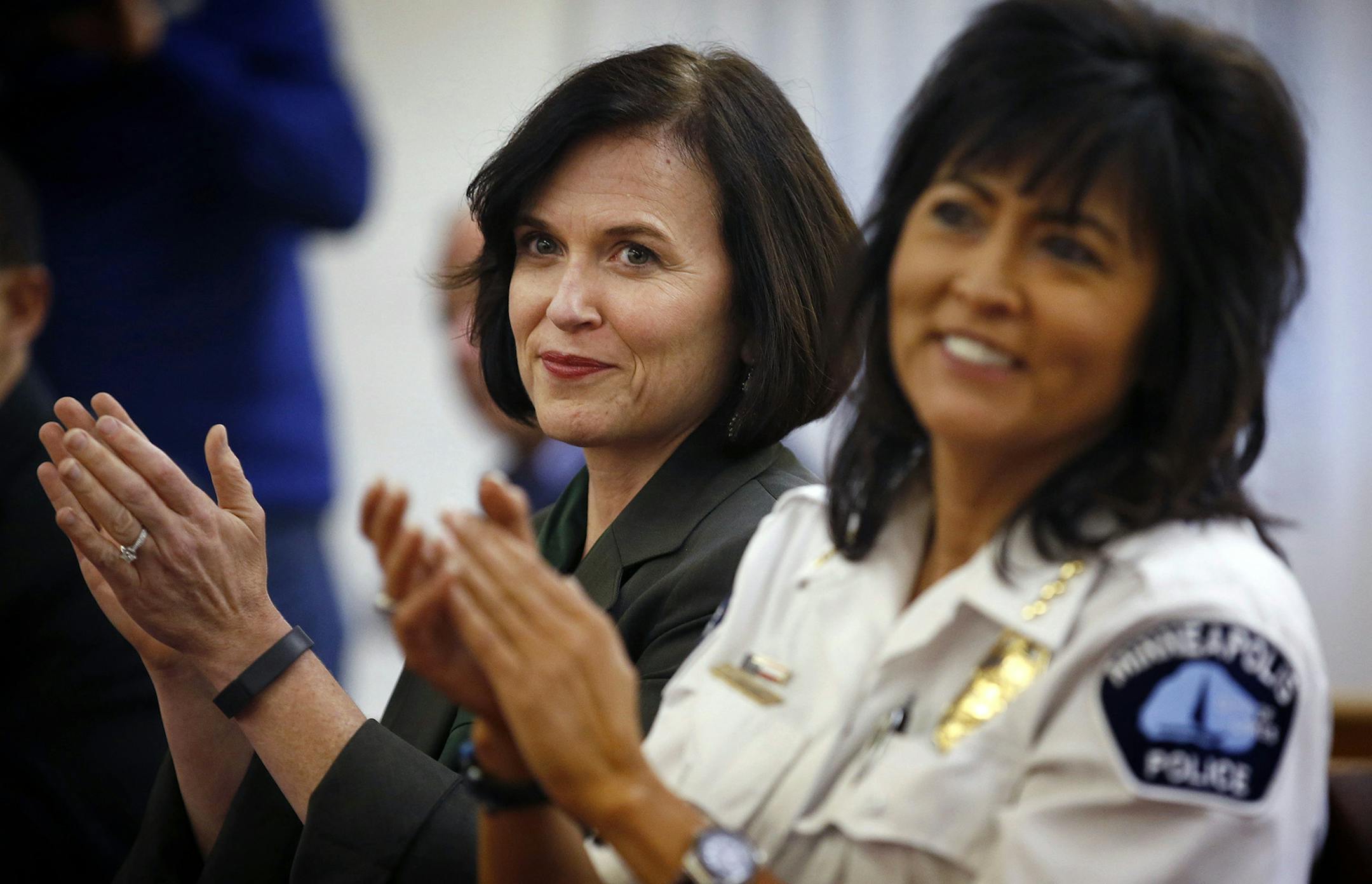 Minneapolis Mayor Betsy Hodges and Police Chief Janee Harteau applauded during a community engagement forum at the Macedonia Baptist Church in Minneapolis on Wednesday evening. ] CARLOS GONZALEZ cgonzalez@startribune.com - October 8, 2014 , Minneapolis, Minn., Macedonia Baptist Church, Mayor Hodges and MPD Chief Harteau are hosting a community engagement forum, weeks after the chief came under fire for pulling out of a similar event due to security concerns. ORG XMIT: MIN1410082109132871 ORG XMI