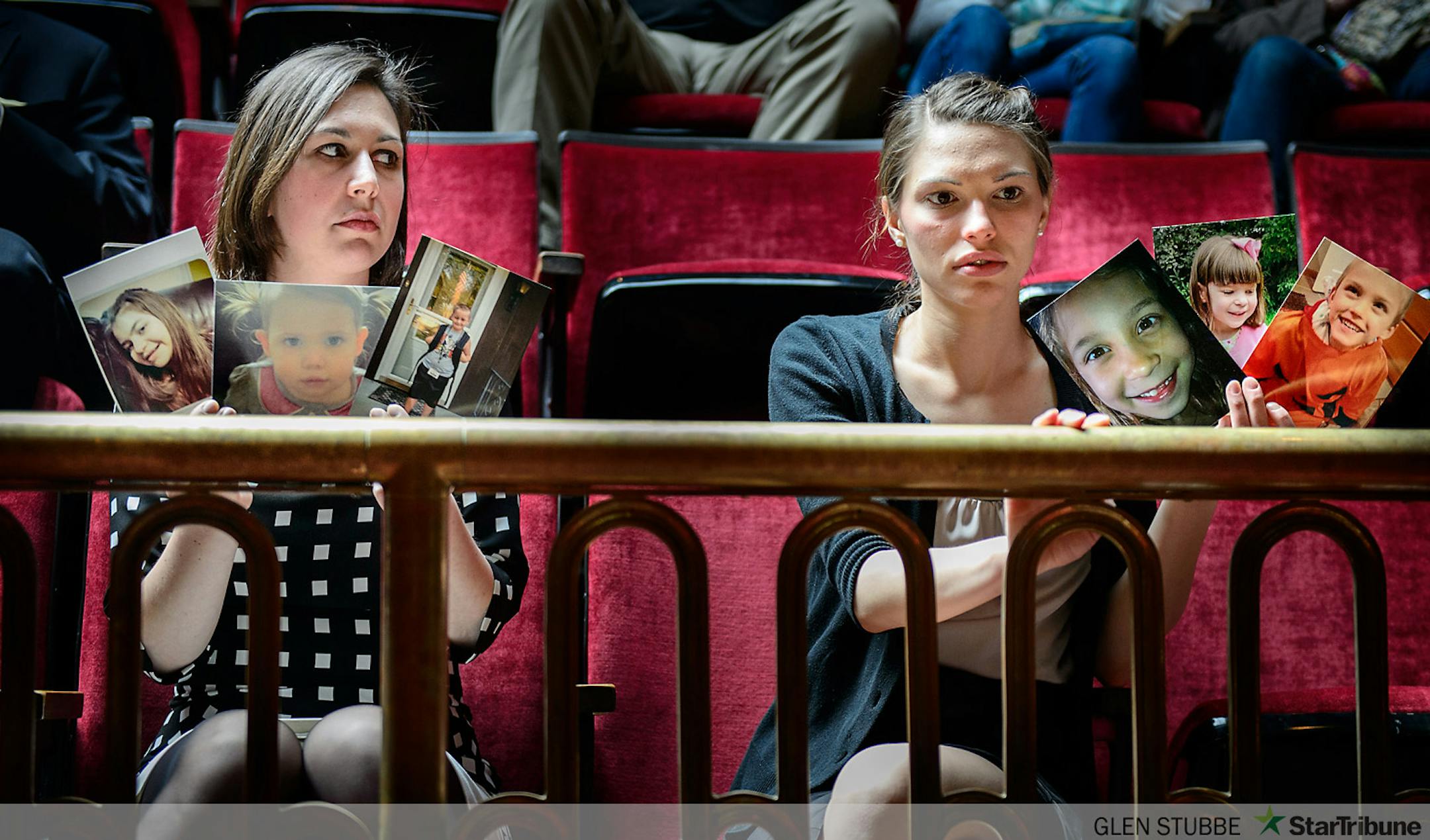 Advocates for Medical marijuana held photos of relatives, loved ones and members of families who couldn't attend the hearing as the bill was debated on the Senate floor.  L to R are  Kendra Miller and Angela Garin.     ]      Tuesday, May 6, 2014   GLEN STUBBE * gstubbe@startribune.com