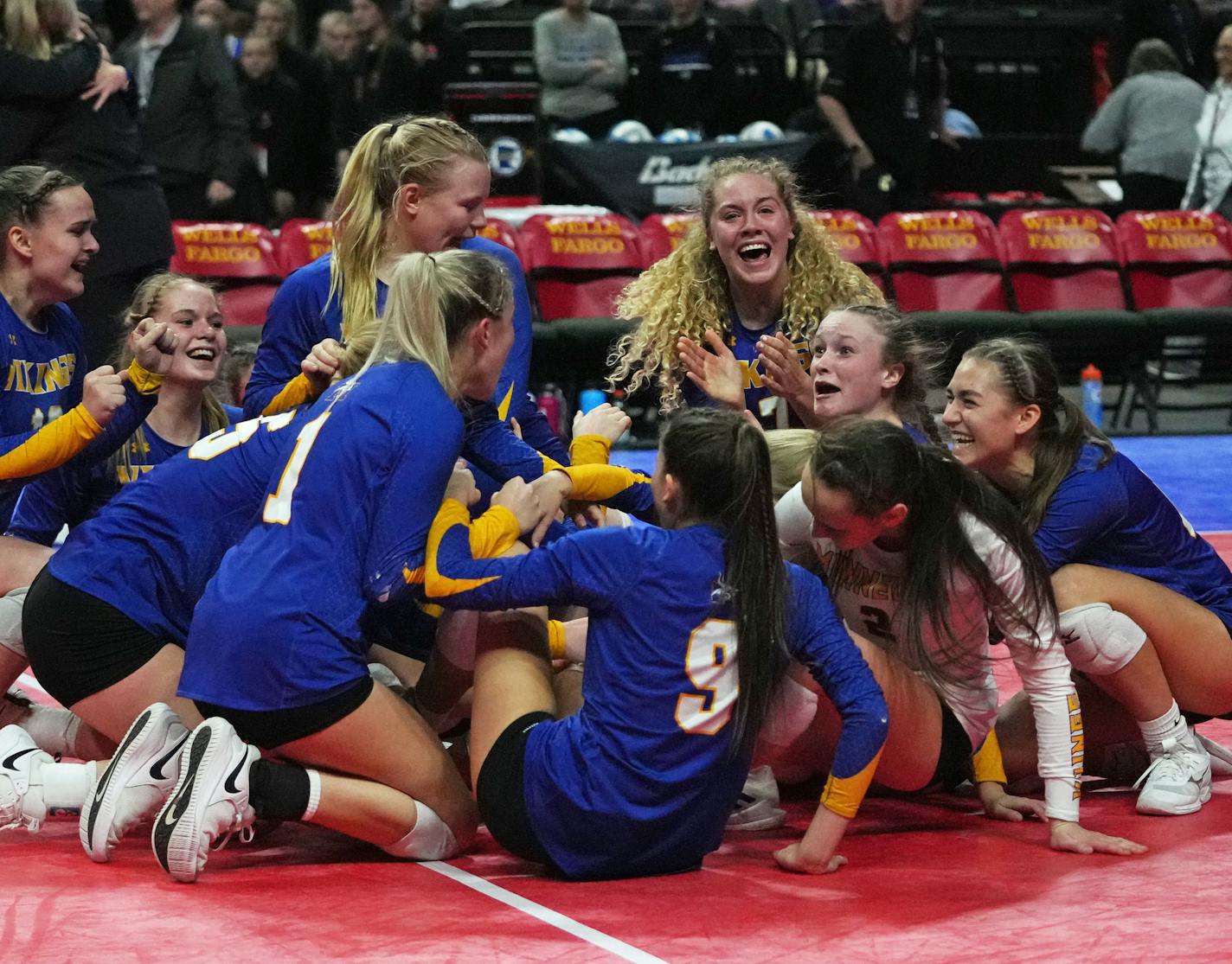 Minneota players celebrate their win over Mayer Lutheran during 1A volleyball finals Saturday, Nov. 12, 2022 at Xcel Energy Center in St. Paul, Minn. ]