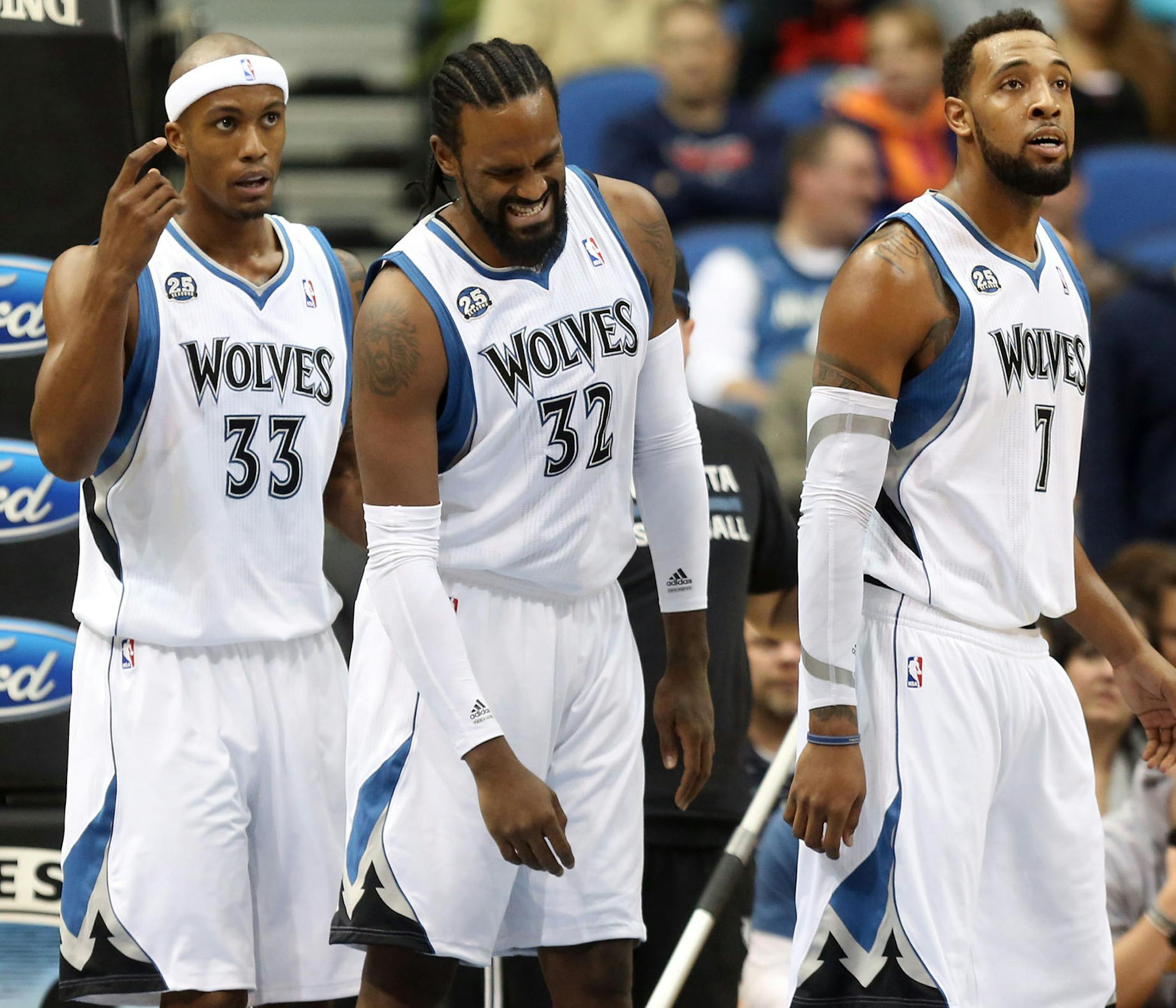Wolves Ronny Turiaf, middle, with teammates Dante Cunningham and Derrick Williams walked off the floor with an injured shoulder from a fall during the first half at the Target Center in Minneapolis Min., Friday, November 1, 2013. ] (KYNDELL HARKNESS/STAR TRIBUNE) kyndell.harkness@startribune.com