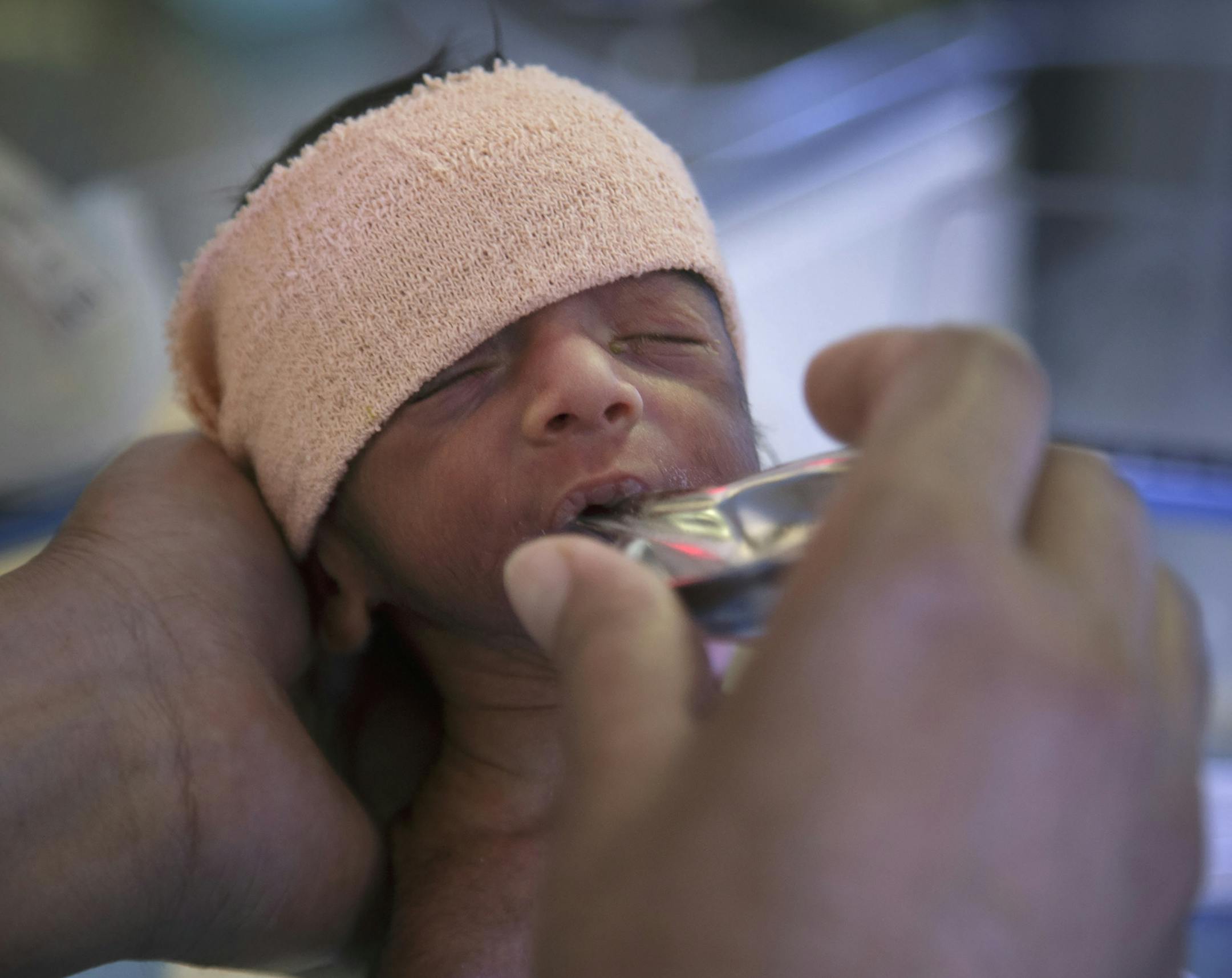 An infant is cared for at the Civil Hospital in Gurgaon, India, Sept. 10, 2014. The poor health of children in India, which has about one-sixth of the world’s population but one-third of all newborn deaths, is one of the world’s most perplexing public health questions. (Kuni Takahashi/The New York Times)