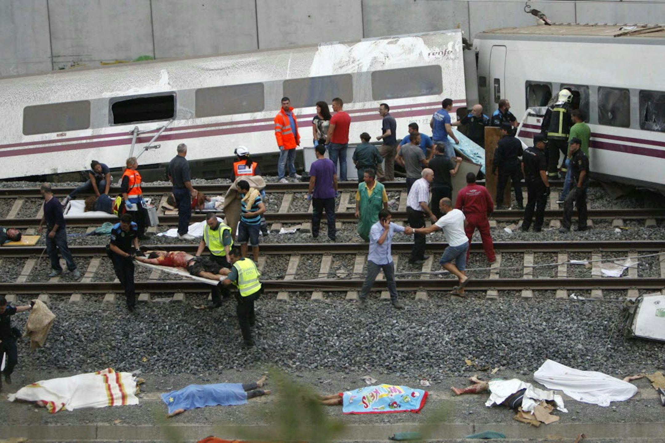 Emergency personnel respond to the scene of a train derailment in Santiago de Compostela, Spain, Wednesday.