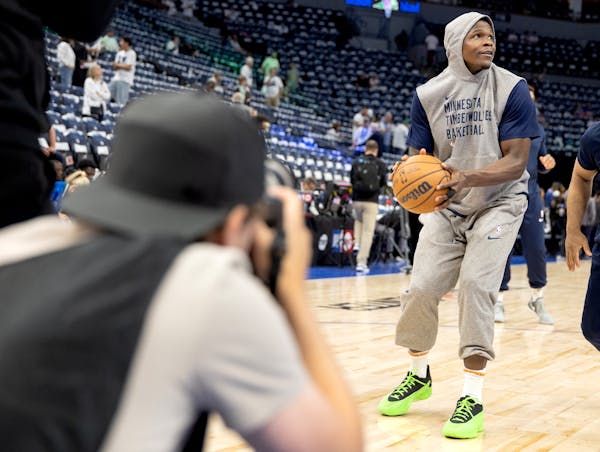 Anthony Edwards of the Timberwolves warms up before tonight's game at Target Center.