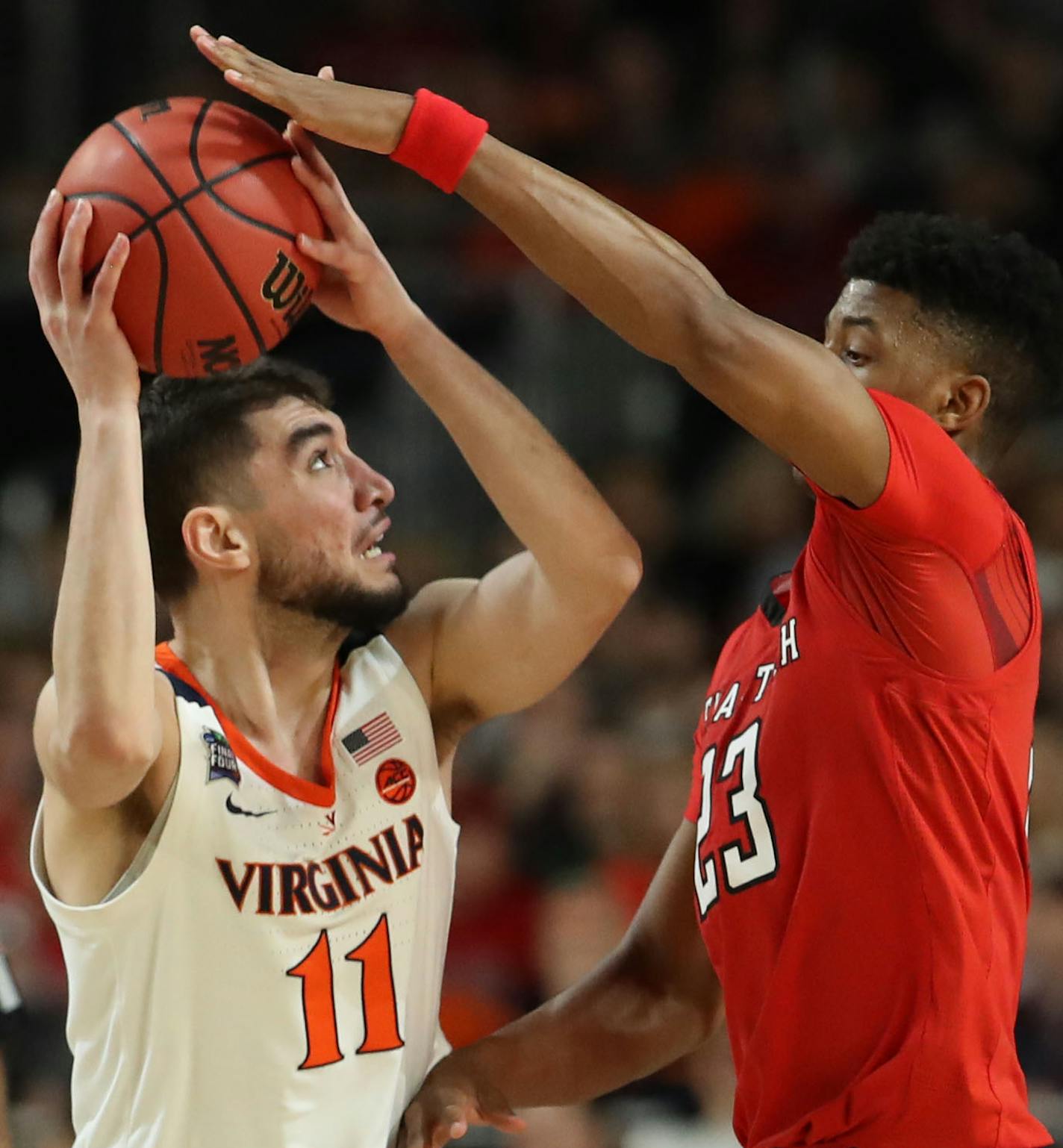 Virginia guard Ty Jerome (11) shot against Texas Tech guard Jarrett Culver (23) during the second half. ] CARLOS GONZALEZ &#xa5; carlos.gonzalez@startribune.com Texas Tech played Virginia in the final of the NCAA Division I Men's Basketball Championship Final Four on Monday, April 8, 2019 at U.S. Bank Stadium in Minneapolis.