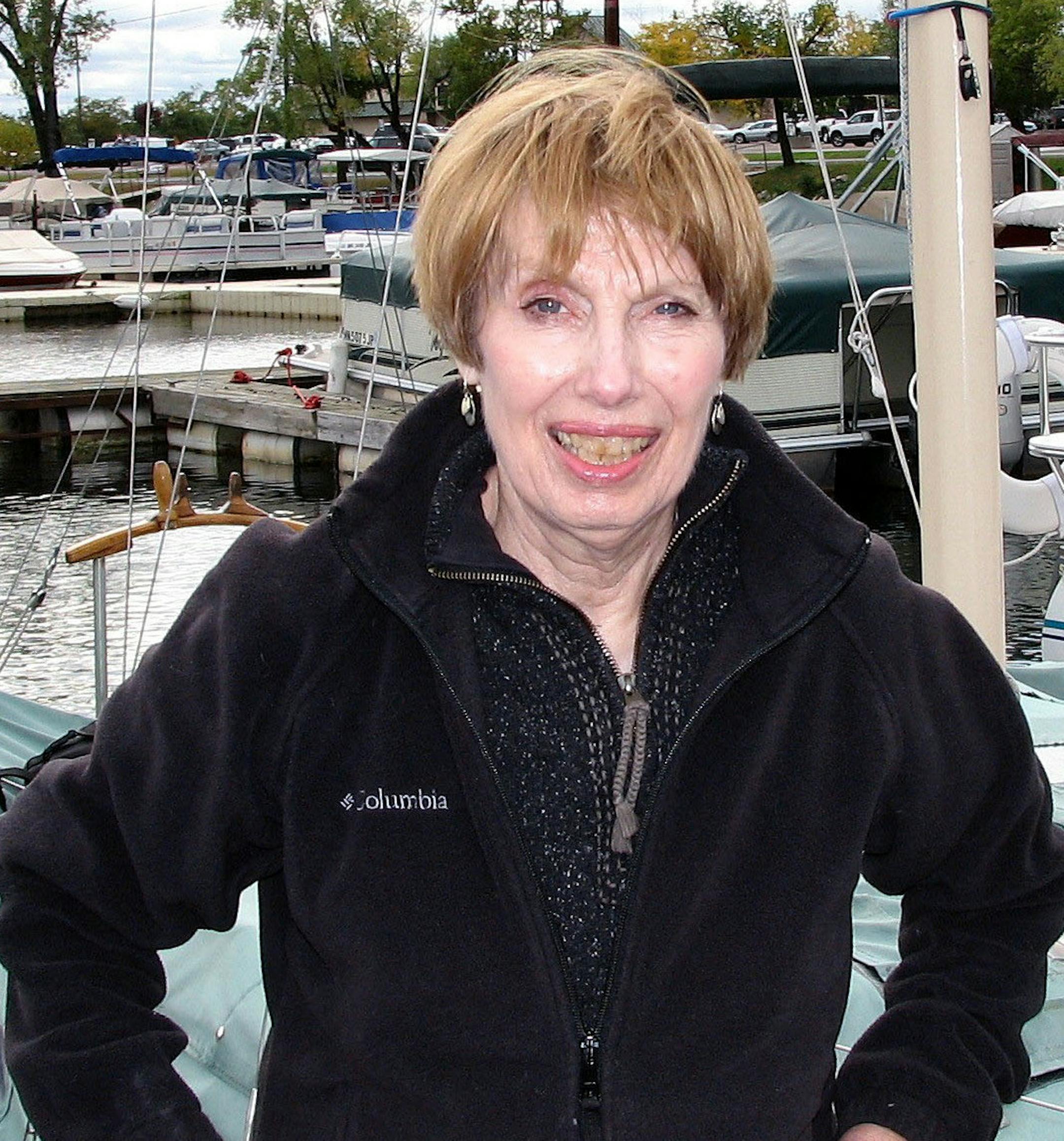 Loris Bree in front of the Bree's 20-foot wooden sailboat, Persistence. Photo courtesy of Marlin Bree marlin.marlor@minn.net website: www.marlinbree.com