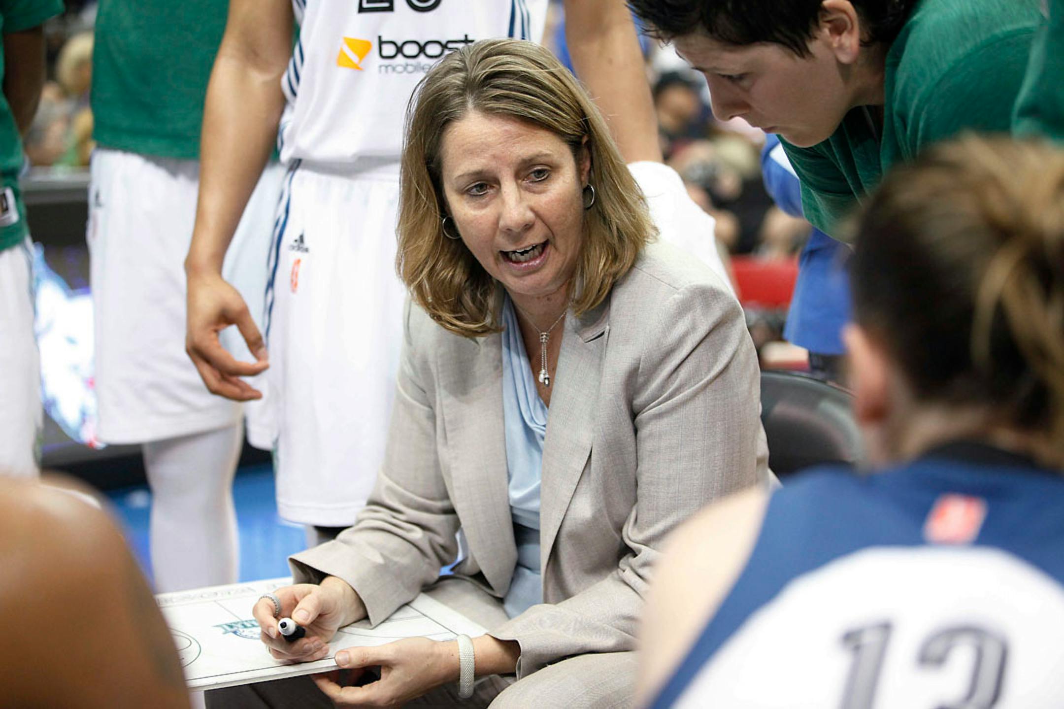 Minnesota Lynx coach Cheryl Reeve talks with her team during a timeout in the second half of a WNBA basketball game against the Los Angeles Sparks, Friday, June 28, 2013, in Minneapolis. The Lynx won 88-64.