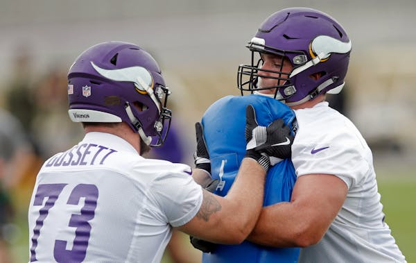 Vikings guard Colby Gossett, left, and tackle Brian O'Neill ran a blocking drill on July 25 in Eagan.