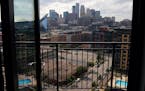 The view of downtown Minneapolis from the Ross' condo. ] ANTHONY SOUFFLE • anthony.souffle@startribune.com Gail and Randy Ross sat for a portrait in