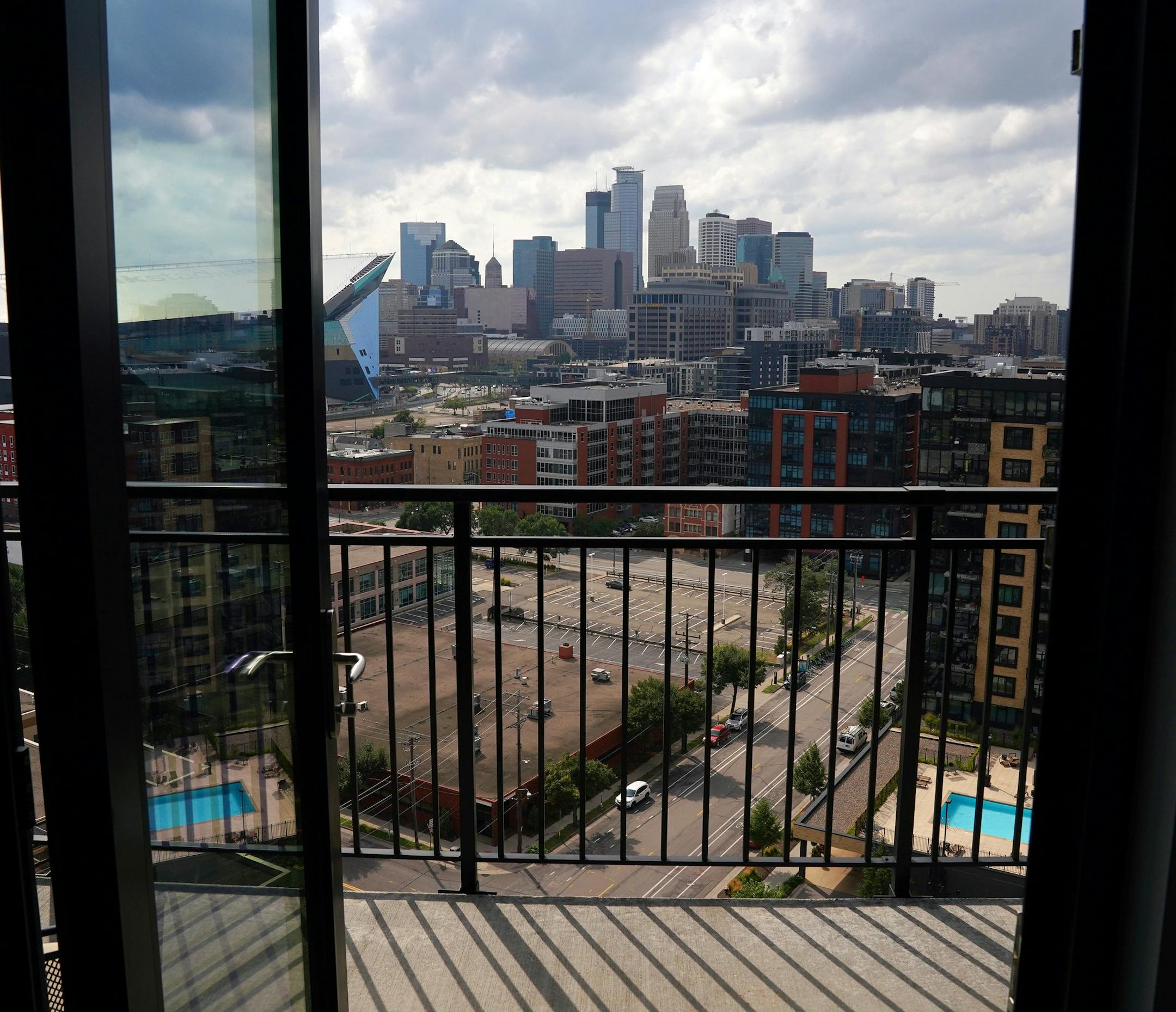 The view of downtown Minneapolis from the Ross' condo. ] ANTHONY SOUFFLE • anthony.souffle@startribune.com Gail and Randy Ross sat for a portrait in their condo on the 14th floor of The Legacy Minneapolis Friday, Aug. 14, 2020 in downtown Minneapolis. The COVID-19 pandemic has changed life downtown with theaters closed, office buildings empty and restaurants doing social distancing.