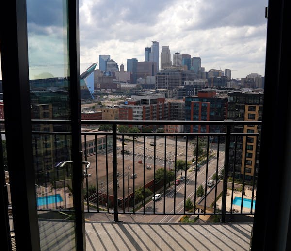 The view of downtown Minneapolis from the Ross' condo. ] ANTHONY SOUFFLE • anthony.souffle@startribune.com Gail and Randy Ross sat for a portrait in