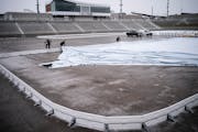 Workers from IceTimeMN put a liner in one of 5 rinks at TCO Stadium Wednesday January ,10 2024 in, Eagan,Minn. ] JERRY HOLT • jerry.holt@startribune