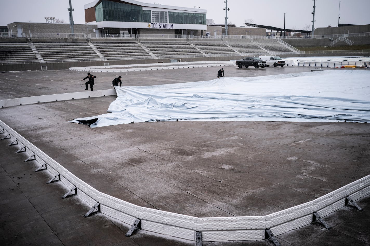 Workers from IceTimeMN put a liner in one of 5 rinks at TCO Stadium Wednesday January ,10 2024 in, Eagan,Minn. ] JERRY HOLT • jerry.holt@startribune.com