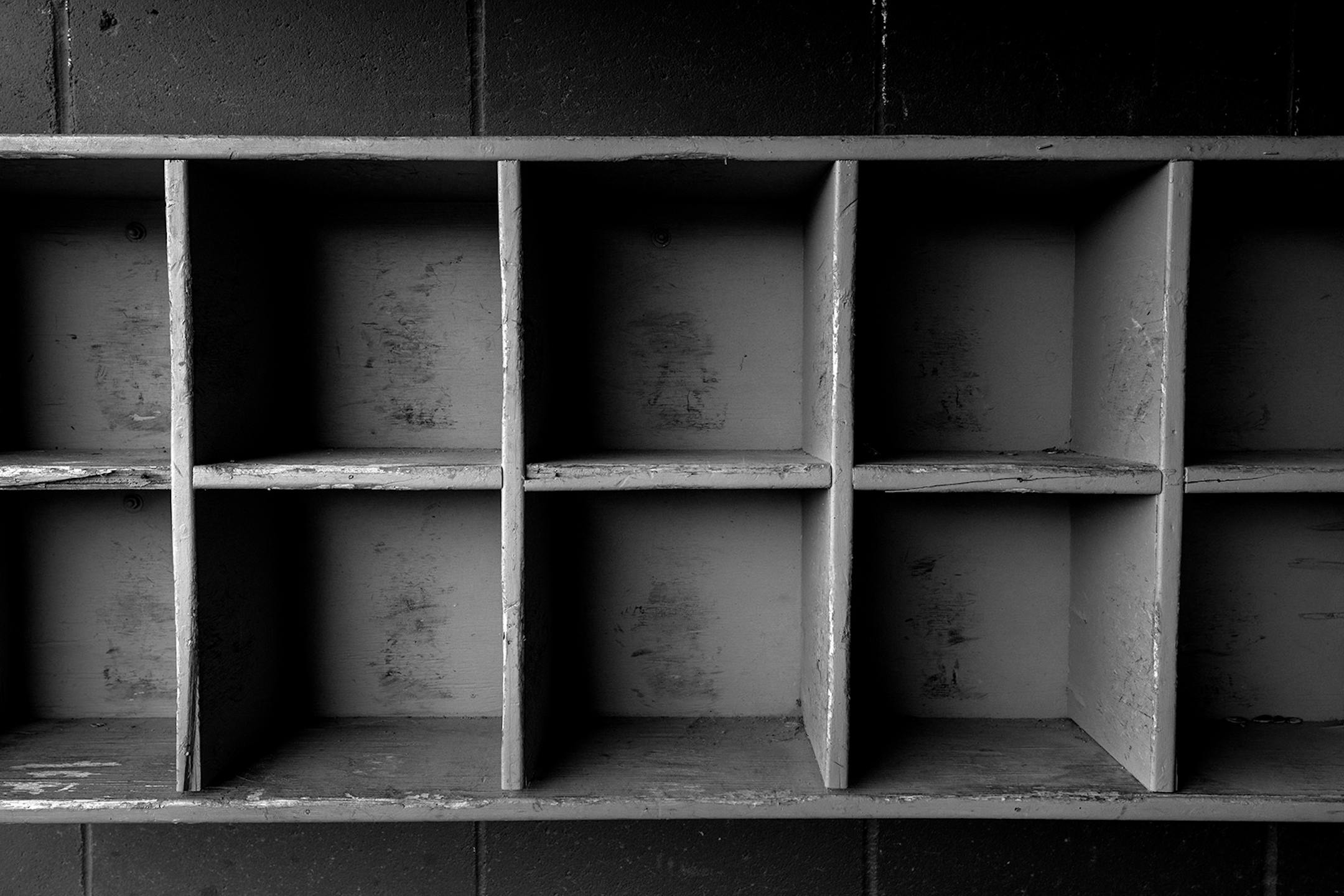 Empty helmet shelves at The Jordan Baseball Park also known as the "Mini Met" in Jordan, Minn.