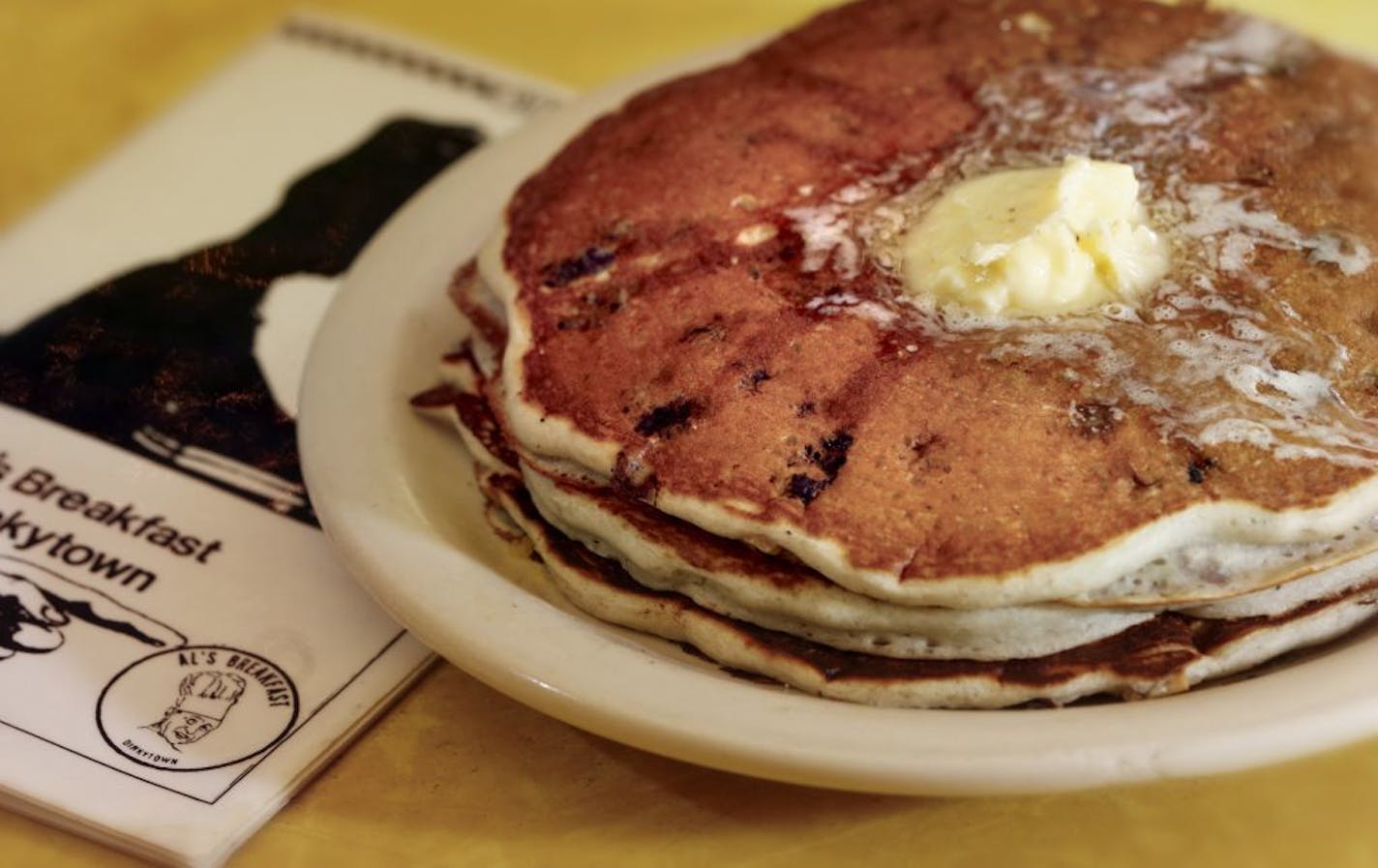 Blueberry/walnut pancakes. A changing of the guard at the institution, Al's Breakfast. Doug Grina, one of the original owners and Alison Kirwin, his new partner, at the tiny 14-seat restaurant. Some of the food they are famous for are dishes like the, blueberry/walnut pancakes, bacon waffle, and the "Jose."