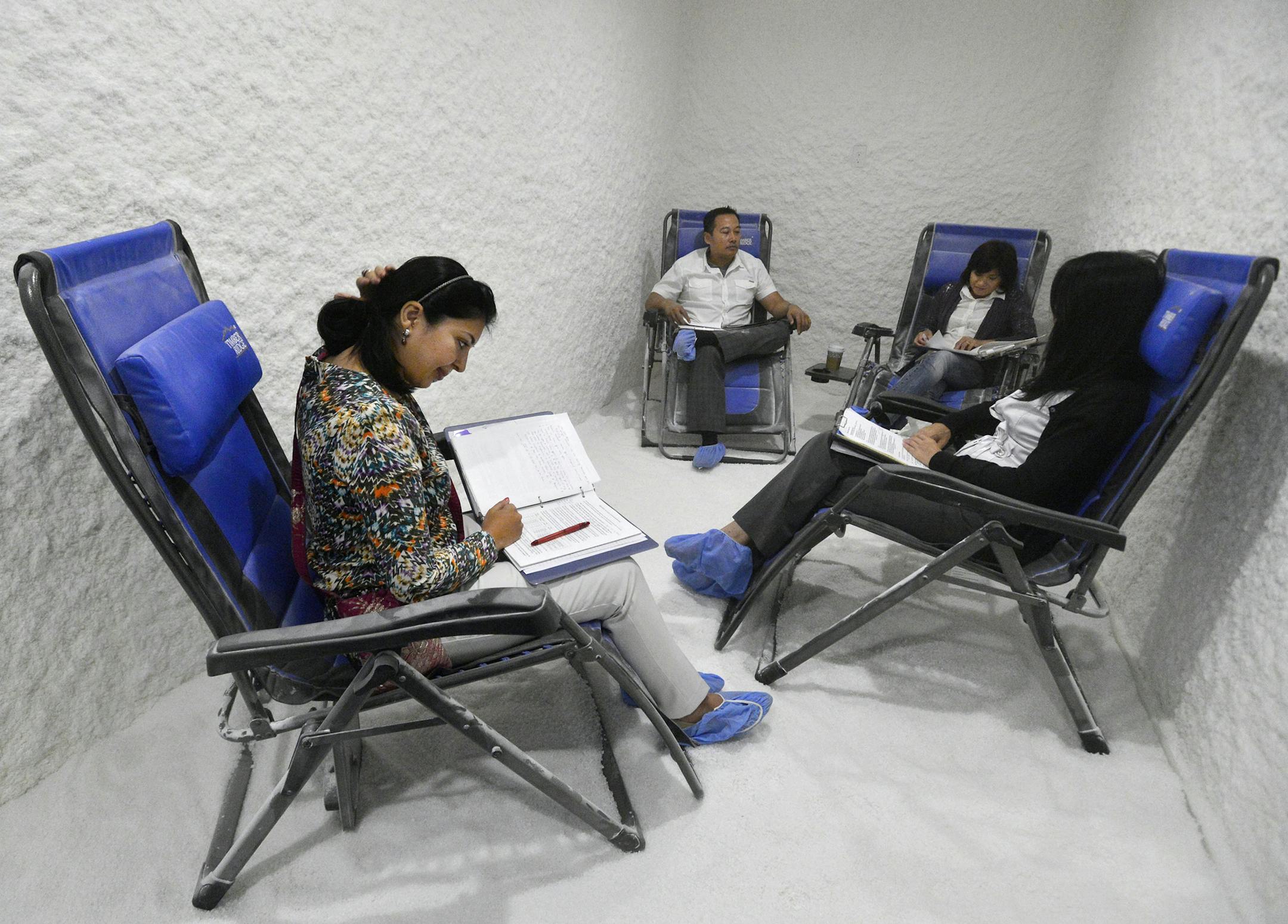 A weekly work meeting with a group of realtors takes place at Salt Spa in Walnut Creek, Calif. Dhevin Tran, center left, says he likes the idea of getting two things done at once, and the therapy helps greatly with his allergies. (Susan Tripp Pollard/Bay Area News Group/MCT)