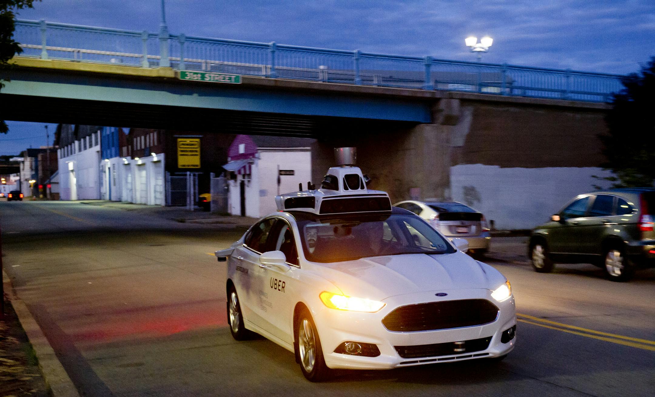 An Uber car drives through city to map out the roads and topography before the introduction of the company’s driverless vehicles in Pittsburgh, Sept. 8, 2016. Uber’s experiment with autonomous vehicles is proceeding with the blessing of city officials, who have pretty much just stayed out of the way. (Jeff Swensen/The New York Times)