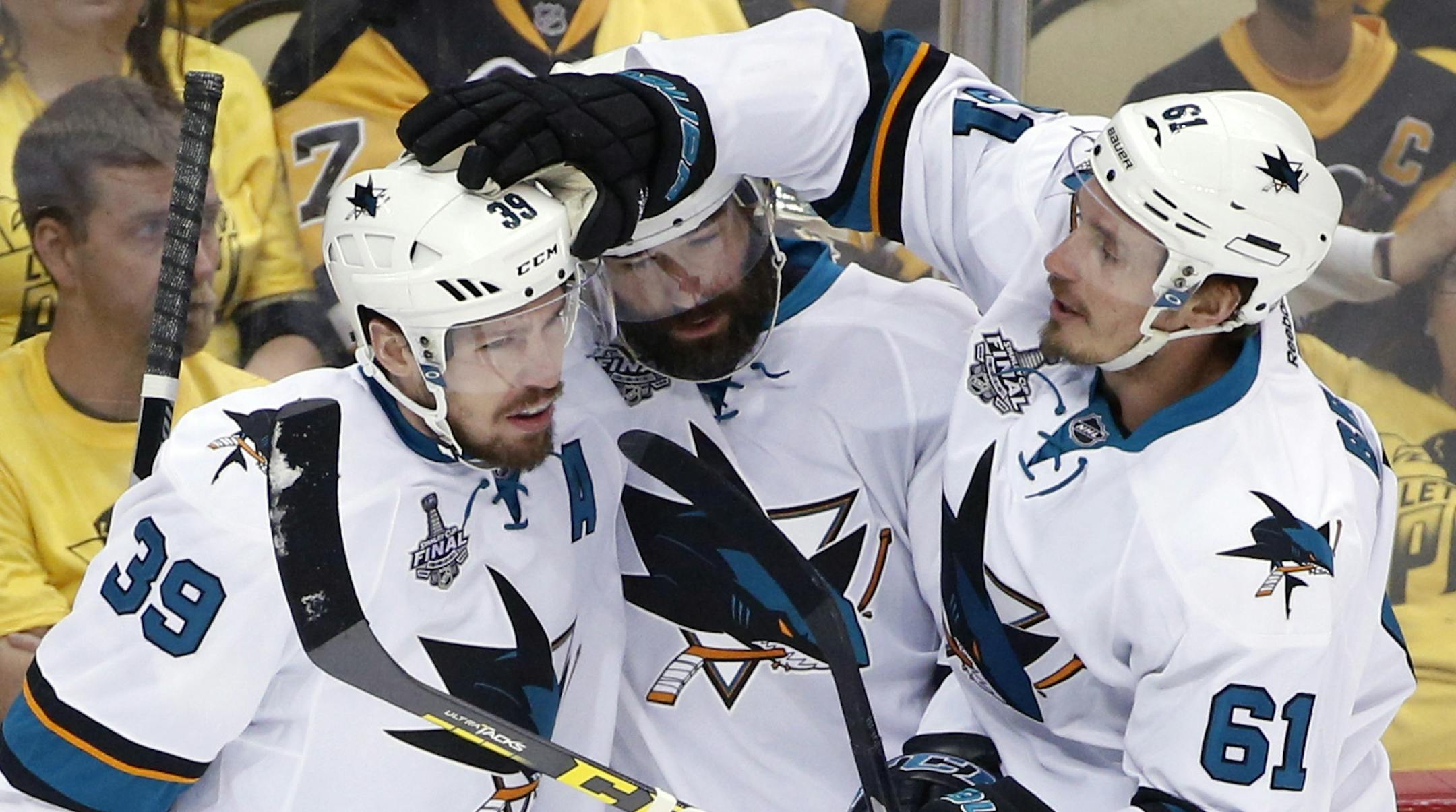 San Jose Sharks' Logan Couture (39) celebrates his goal against the Pittsburgh Penguins with teammates during the first period in Game 5 of the NHL hockey Stanley Cup Finals on Thursday, June 9, 2016, in Pittsburgh. (AP Photo/Gene J. Puskar)
