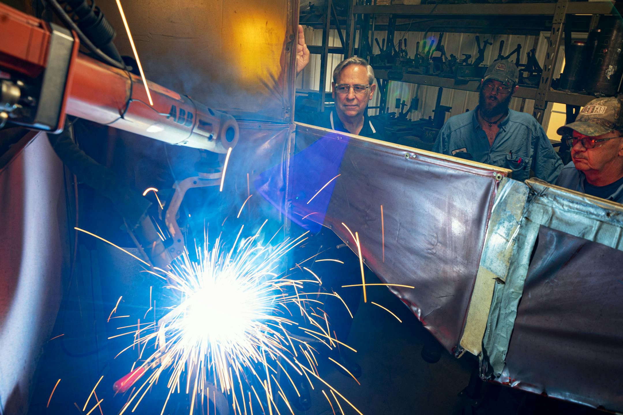 In tis September 2019 file photo, Loren Nelson, left, watched a robotic welder weld connecting ports on a hydraulic cylinder at Aurelius Manufacturing in Braham, Minn. (Staff photo by Glen Stubbe) ORG XMIT: MIN1909091527058395