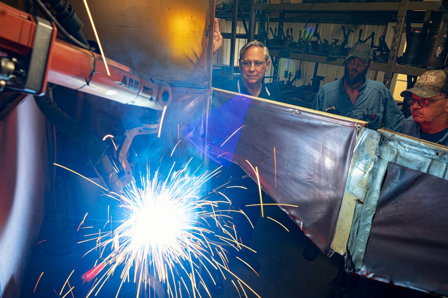 In tis September 2019 file photo, Loren Nelson, left, watched a robotic welder weld connecting ports on a hydraulic cylinder at Aurelius Manufacturing in Braham, Minn. (Staff photo by Glen Stubbe) ORG XMIT: MIN1909091527058395