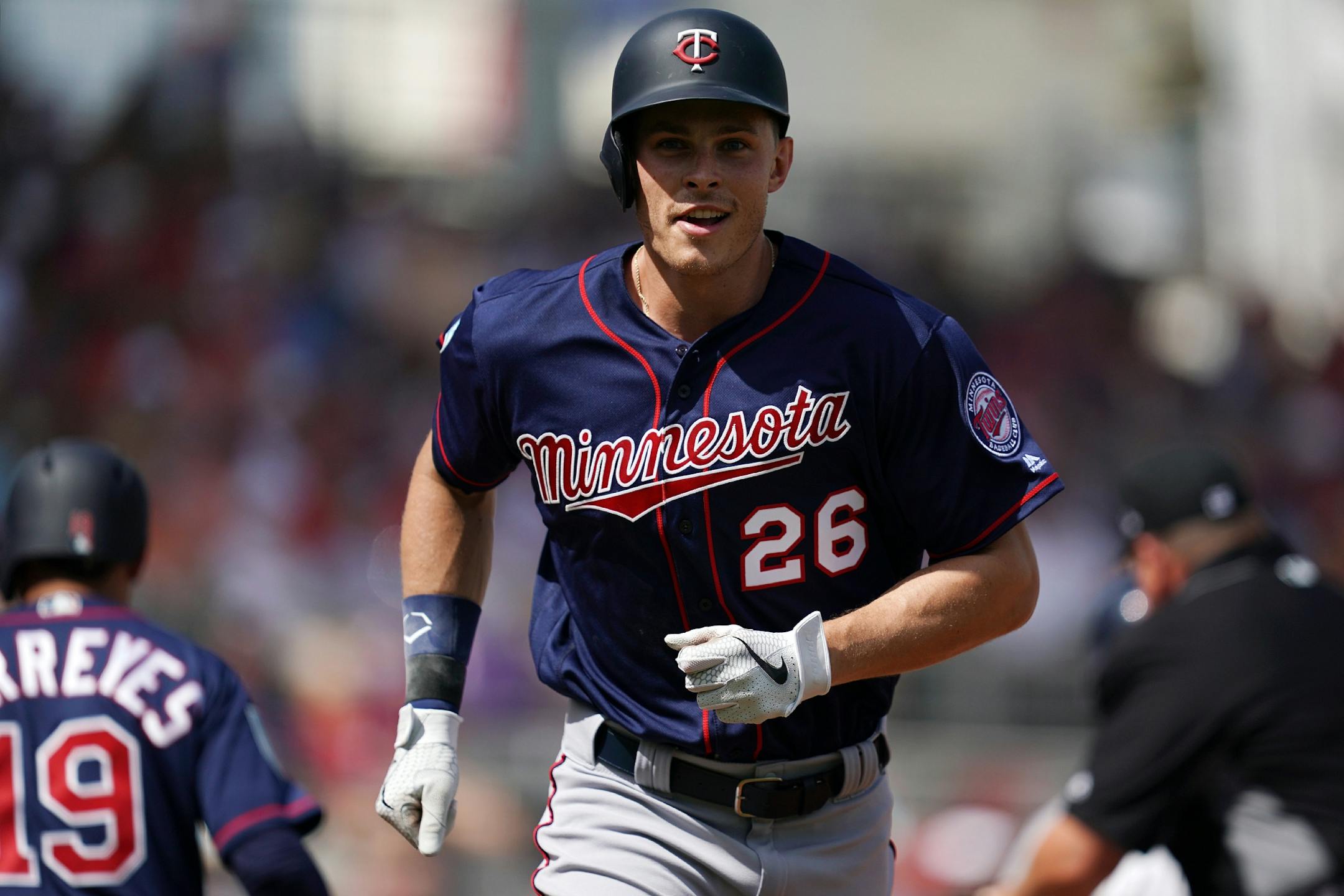 Minnesota Twins right fielder Max Kepler (26) smiled as he ran back into the dugout after hitting a home run in his first at bat during Sunday's game.