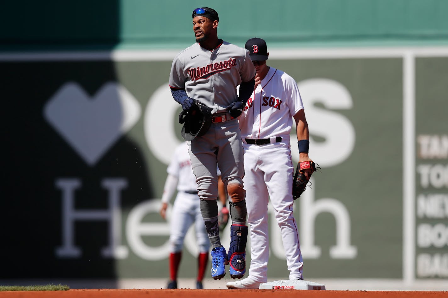 Byron Buxton reacts after being injured sliding into second after a double during the first inning Friday in Boston.