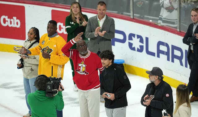 Minnesota Sports Hall of Fame inductees were recognized at the Wild game on April 6. Longtime basketball coach Larry McKenzie waved as the crowd cheer