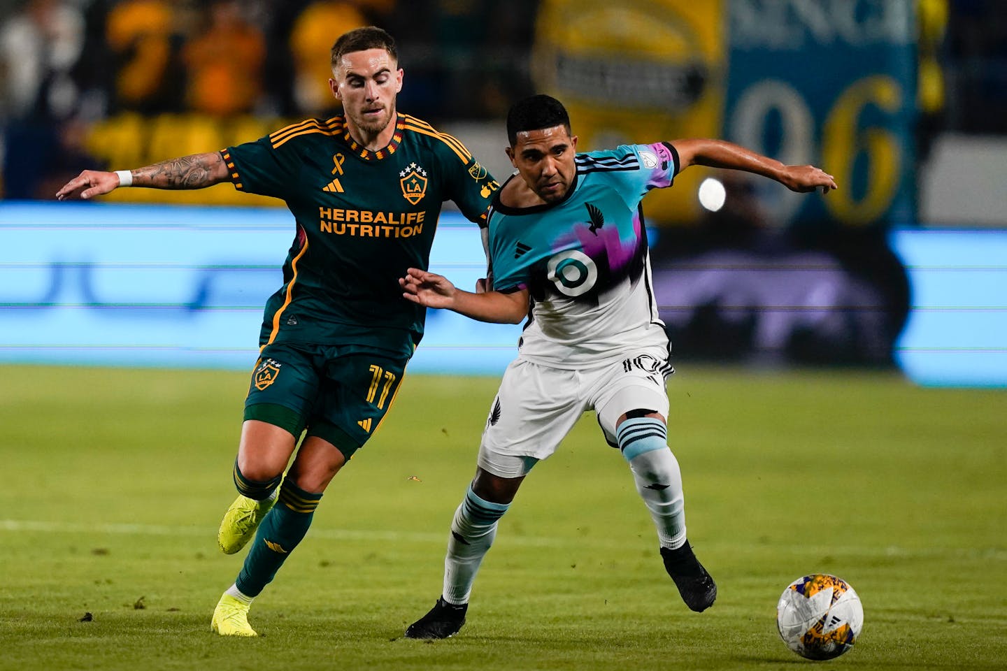 Minnesota United's Emanuel Reynoso, right, and the L.A. Galaxy's Tyler Boyd vied for the ball Wednesday night in Carson, Calif. The Galaxy won 4-3. Reynoso was subbed out at halftime injured.