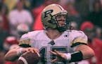 Purdue quarterback Drew Brees (15) looks downfield for a receiver during his team's 25-22 last minute loss to Ohio State Saturday, Oct. 10, 1999, in C
