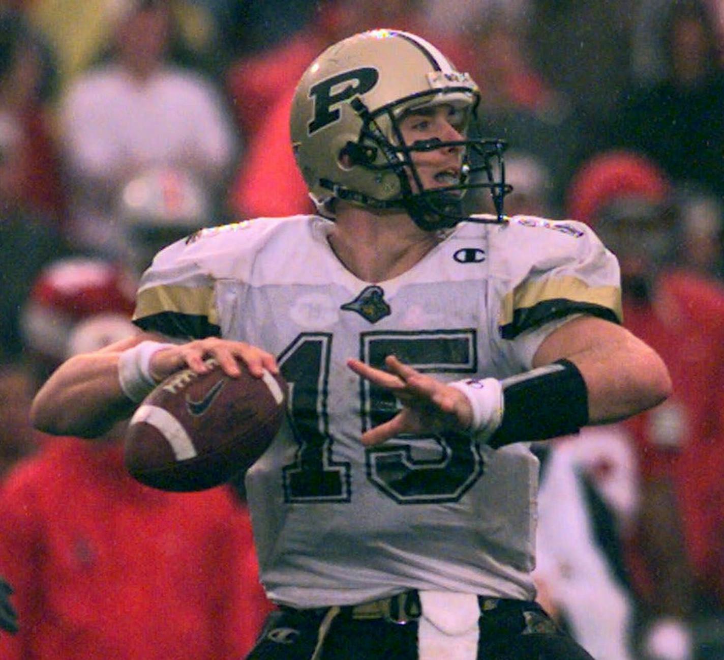 Purdue quarterback Drew Brees (15) looks downfield for a receiver during his team's 25-22 last minute loss to Ohio State Saturday, Oct. 10, 1999, in Columbus, Ohio. Brees will lead the Boilermakers against undefeated Michigan State Saturday. (AP Photo/Chris Putman) ORG XMIT: NY157,NY157