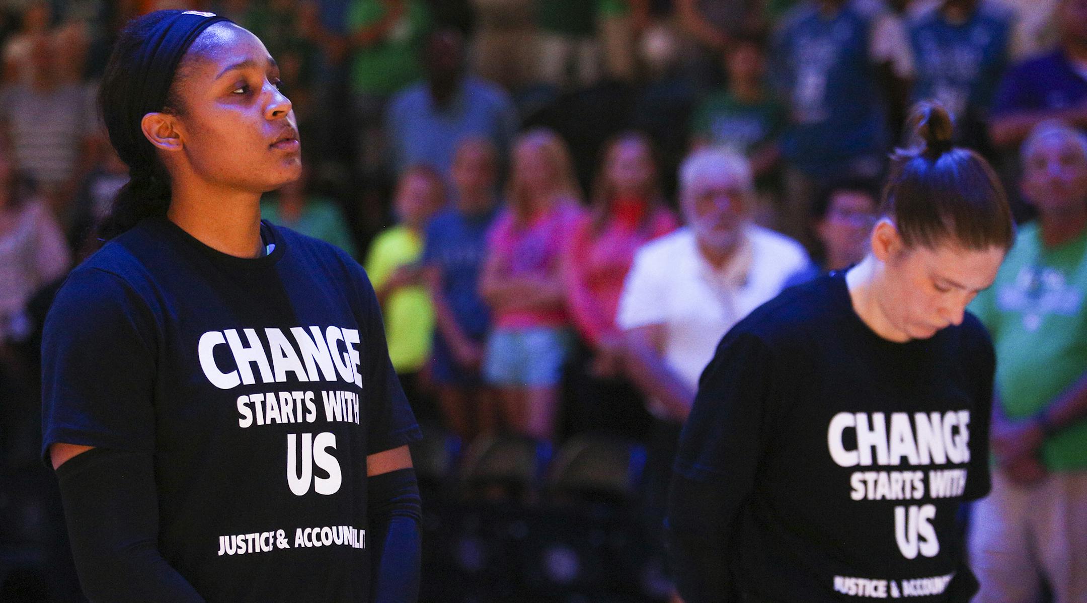 Minnesota Lynx forward Maya Moore (23) and Minnesota Lynx guard Lindsay Whalen (13) observe a moment of silence in honor of Philando Castile. ] Timothy Nwachukwu • timothy.nwachukwu@startribune.com The Minnesota Lynx play the Dallas Wings at the Target Center on Saturday, July 9, 2016. ORG XMIT: MIN1607092027273018
