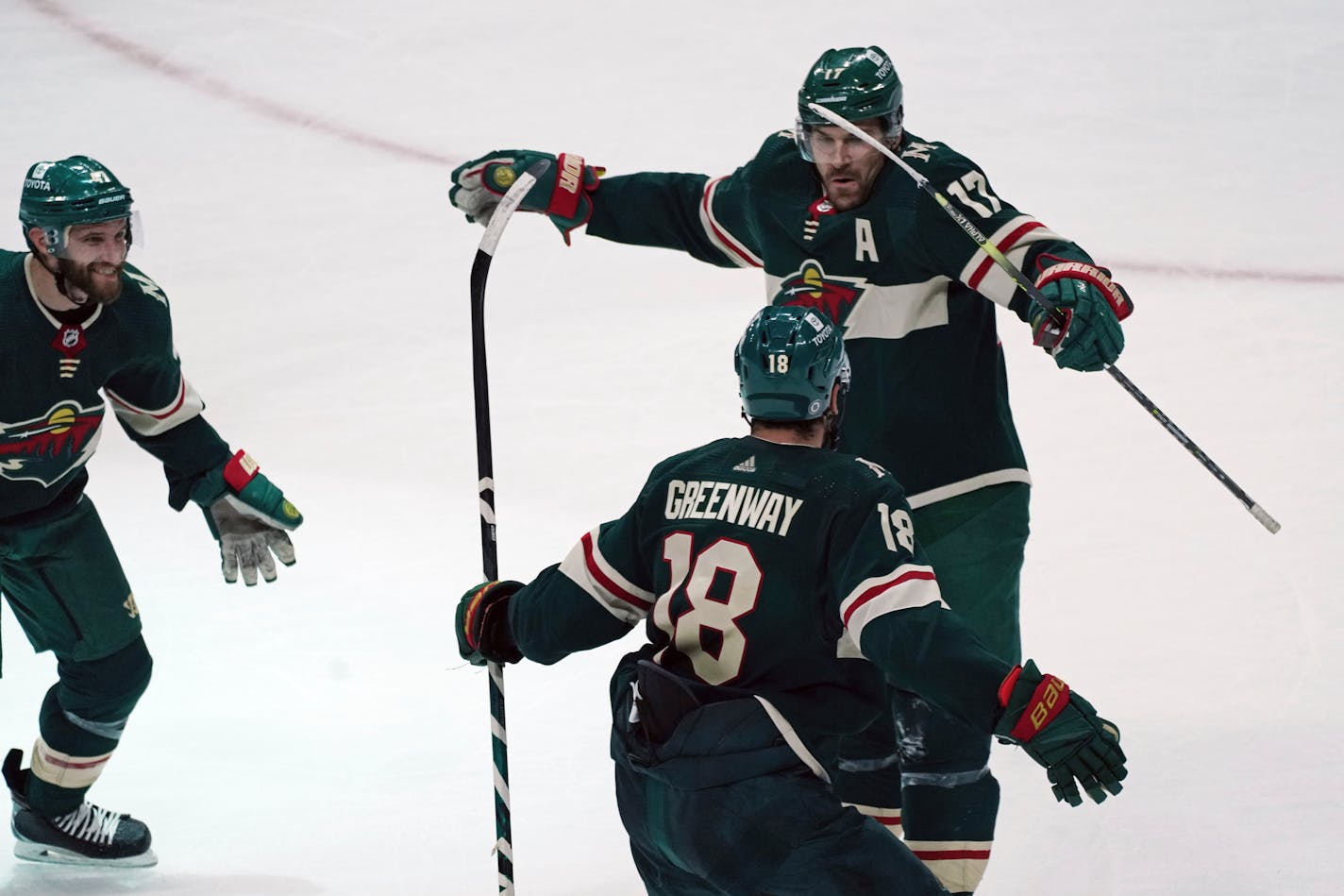 The Wild's Marcus Foligno leaps as he celebrates his overtime goal on Blackhawks goalie Kevin Lankinen Saturday night in St. Paul