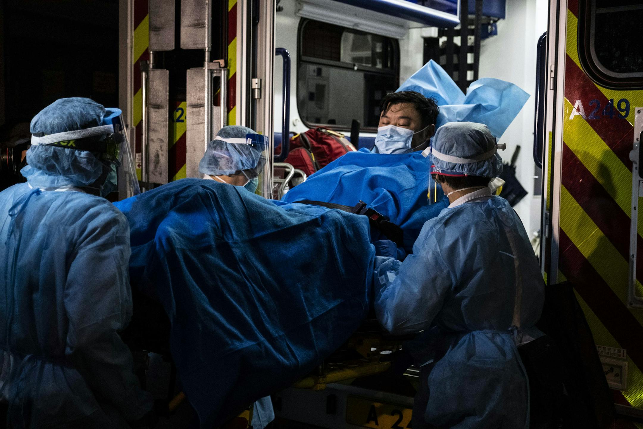 Paramedics transport a man believed to be Hong Kong’s first Wuhan coronavirus patient to a hospital on Wednesday, Jan. 22, 2019. The authorities are scrambling to control a virus that has sickened more than 470 people, killed nine, and spread around the region and to the United States. (Lam Yik Fei/The New York Times)