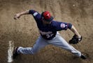 Minnesota Twins pitcher Ryan Vogelsong winds up to throw in the bullpen during a baseball spring training workout in Fort Myers, Fla., Thursday, Feb. 