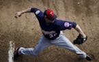 Minnesota Twins pitcher Ryan Vogelsong winds up to throw in the bullpen during a baseball spring training workout in Fort Myers, Fla., Thursday, Feb. 