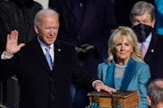 President Joe Biden takes the oath of office from Supreme Court Chief Justice John Roberts as his wife, Jill Biden, stands next to him during the 59th