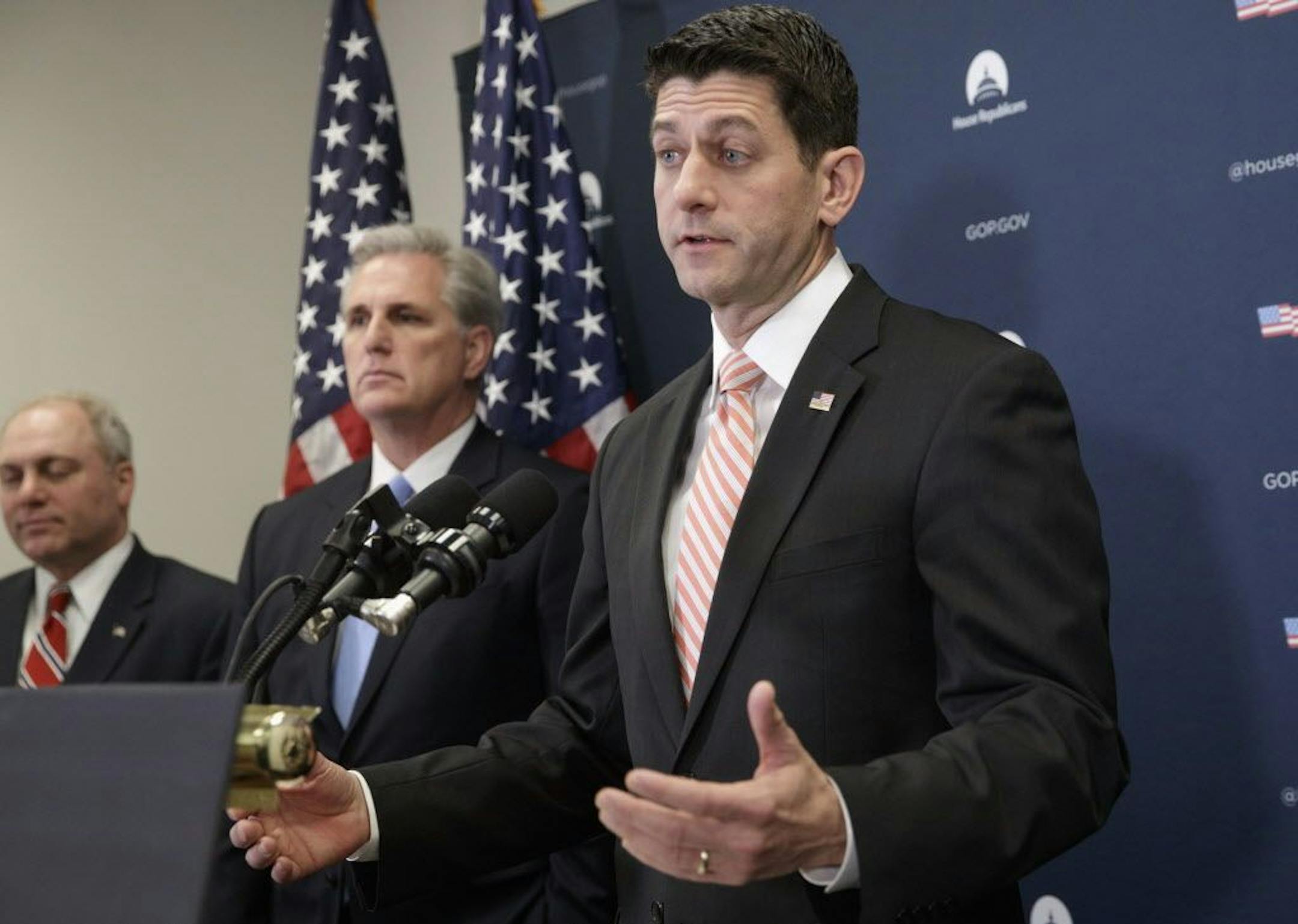 House Speaker Paul Ryan of Wis., right, gave a strong defense of President Donald Trump's refugee and immigration ban to caucus members and said he backs the executive order.