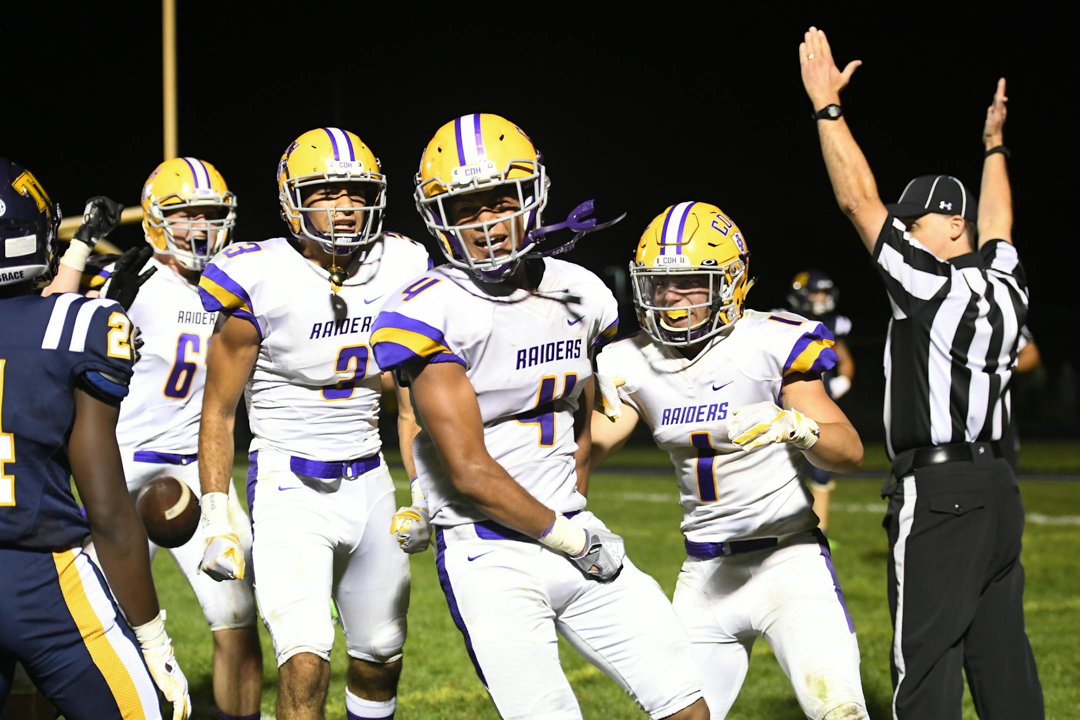 Cretin-Derham Hall's Rajiv Redd (4) celebrated with teammates after scoring a 2-point conversion in overtime to win the game against Totino-Grace Thursday night. ] AARON LAVINSKY ¥ aaron.lavinsky@startribune.com Totino-Grace played Cretin-Derham Hall in a Class 6A football game on Thursday, Aug. 30, 2018 at Totino-Grace High School in Fridley, Minn.
