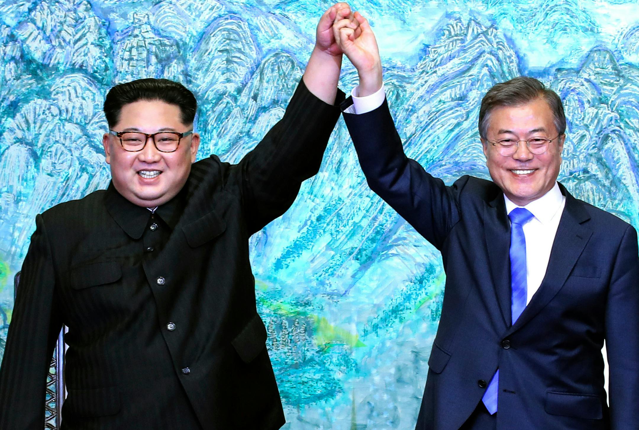 FILE - In this Friday, April 27, 2018, file photo, North Korean leader Kim Jong Un, left, and South Korean President Moon Jae-in raise their hands after signing a joint statement at the border village of Panmunjom in the Demilitarized Zone. The Panmunjom Declaration has lots of accords on improving inter-Korean ties and exchange programs but lacks any major progress in a U.S.-led international effort to end the North Korean nuclear standoff. (Korea Summit Press Pool via AP, File)